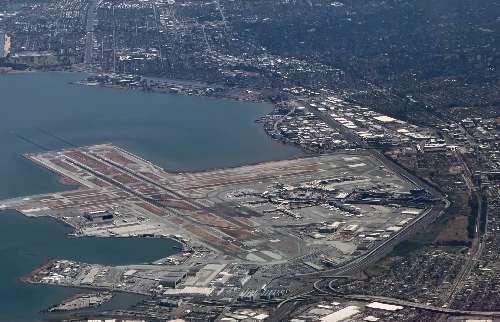 Runway with hangar taxiways and terminals on the grounds of the airport 
